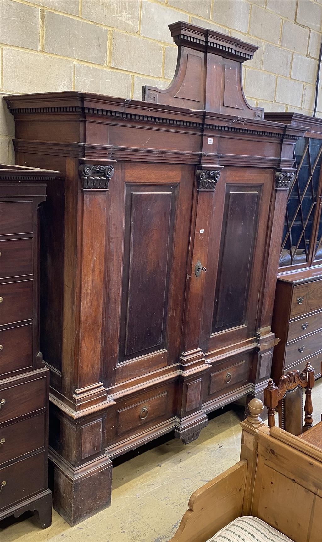 A large early 18th century German mahogany Schrank, width 190cm, depth 71cm, height 267cm